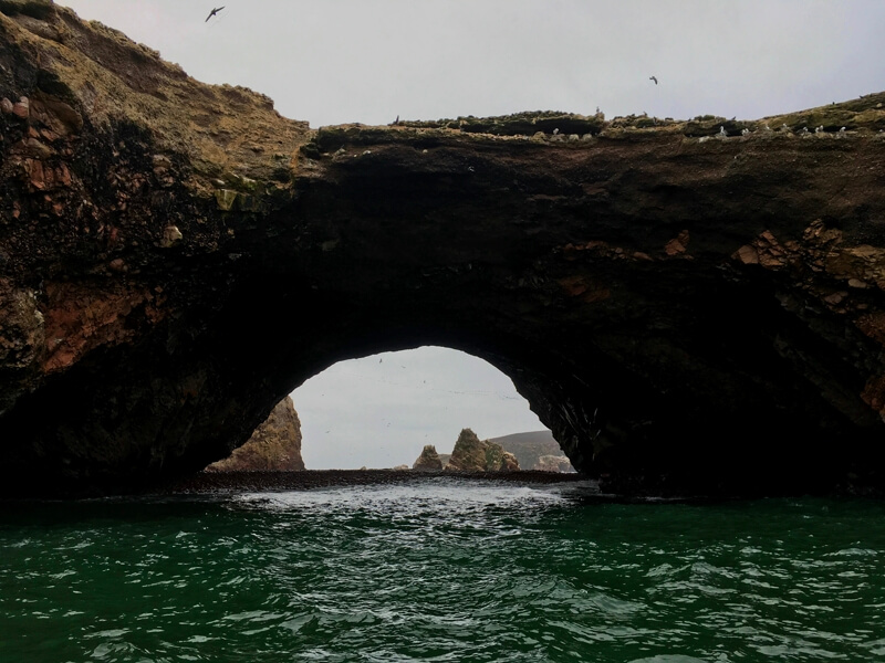 Natural arch during Lima to Cusco 13 Days Overland Tour